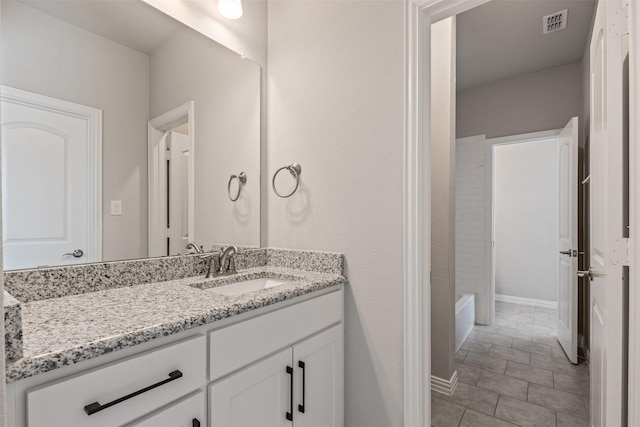 bathroom with vanity and visible vents