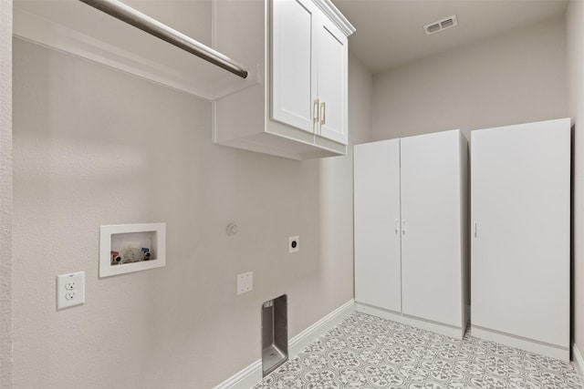 clothes washing area with visible vents, baseboards, washer hookup, cabinet space, and hookup for an electric dryer