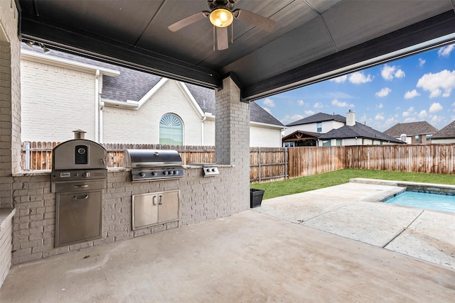 view of patio / terrace featuring a ceiling fan, area for grilling, and a fenced backyard