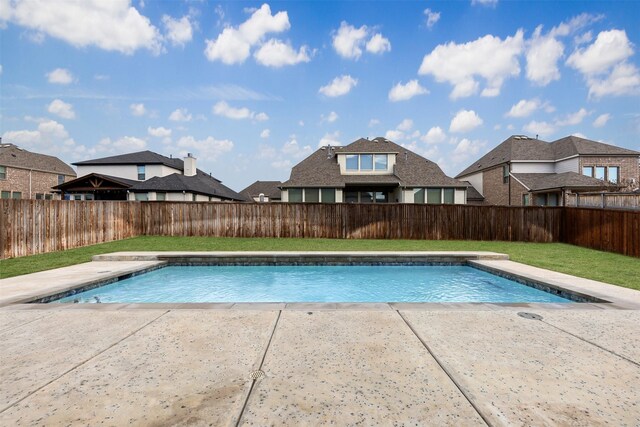 view of swimming pool featuring a fenced in pool, a patio, and a fenced backyard