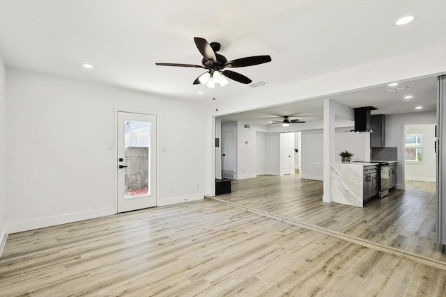 unfurnished living room featuring baseboards, visible vents, recessed lighting, ceiling fan, and light wood-type flooring