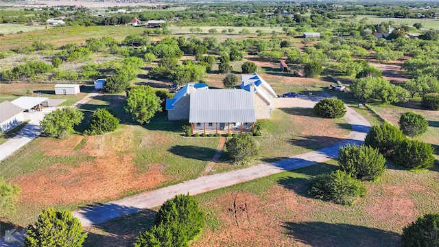 782 Bell Plains Rd, Tuscola, TX 79562 - view of front of house featuring metal roof, a chimney, a front lawn, and dirt driveway