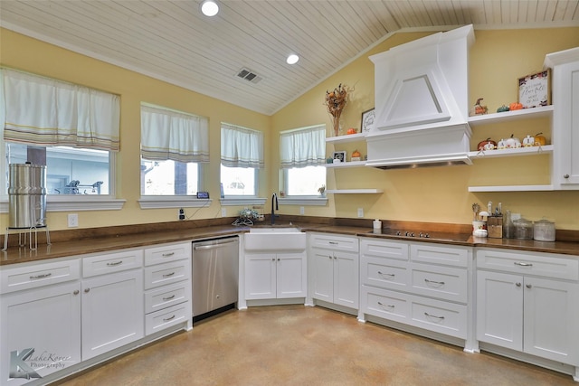 782 Bell Plains Rd, Tuscola, TX 79562 - kitchen with vaulted ceiling, concrete flooring, stainless steel appliances, and white cabinetry
