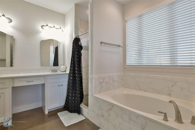 full bathroom featuring vanity, a garden tub, a healthy amount of sunlight, and tiled shower