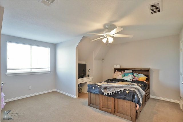 bedroom with visible vents, light carpet, and baseboards