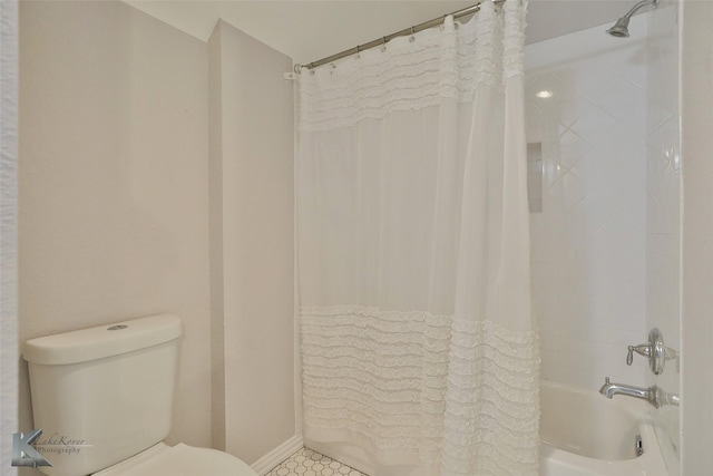 full bath with shower / bath combo with shower curtain and toilet