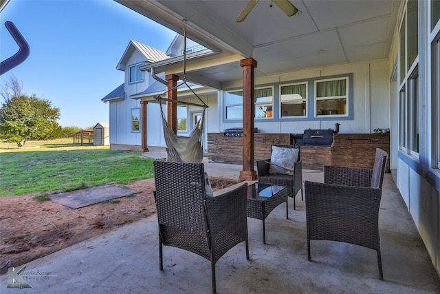 view of patio / terrace with an outdoor hangout area, an outbuilding, a ceiling fan, and a shed