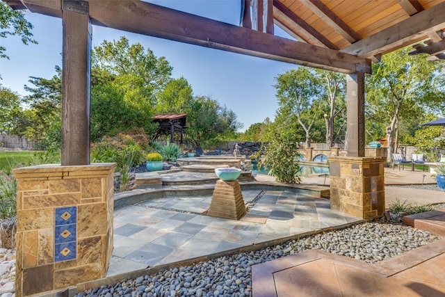 view of patio with a fenced in pool and fence