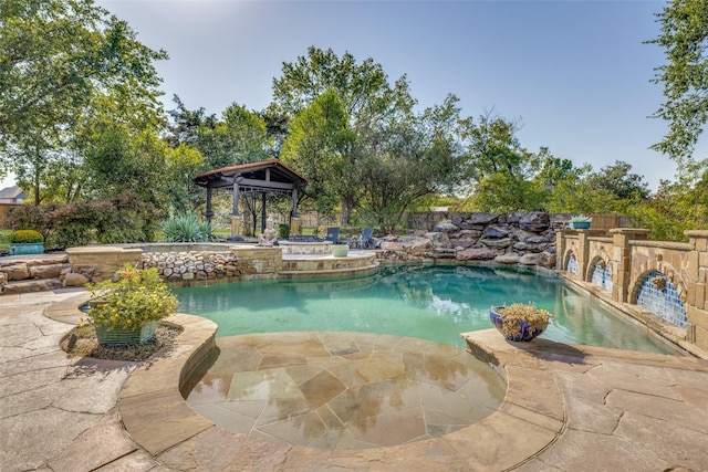 view of pool with a gazebo, a fenced in pool, and a patio