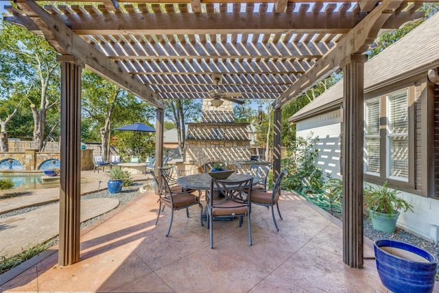 view of patio with outdoor dining area, fence, and a pergola