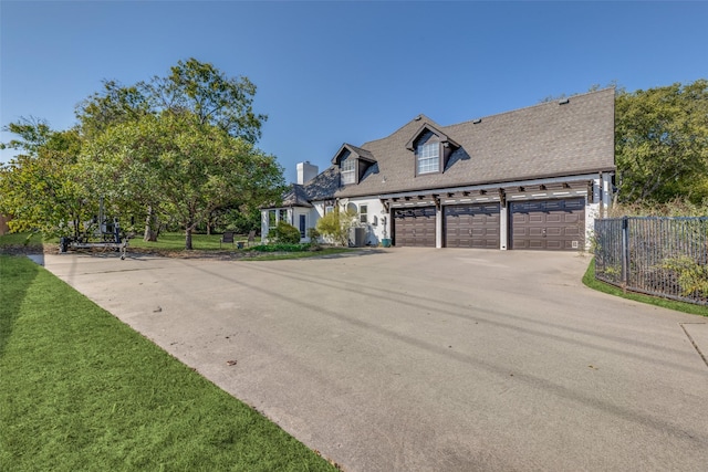 cape cod home with a front lawn, driveway, fence, a garage, and a chimney