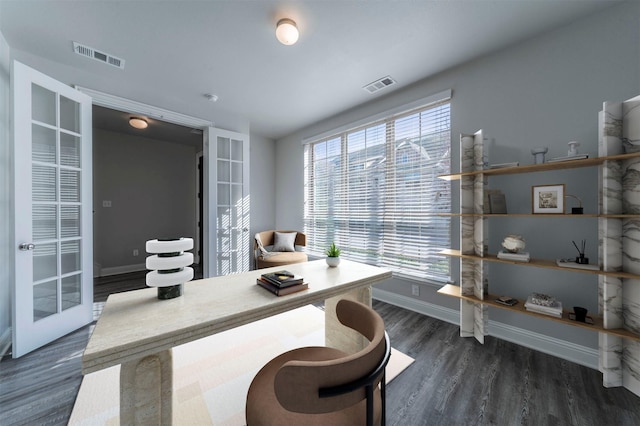 office space with french doors, baseboards, visible vents, and wood finished floors