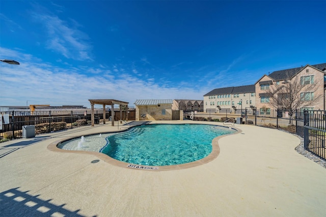 pool with a patio, fence, and a pergola