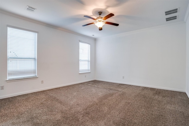 unfurnished room with visible vents, carpet, ceiling fan, and crown molding