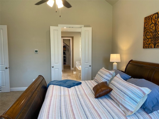 bedroom featuring light colored carpet, baseboards, and ceiling fan