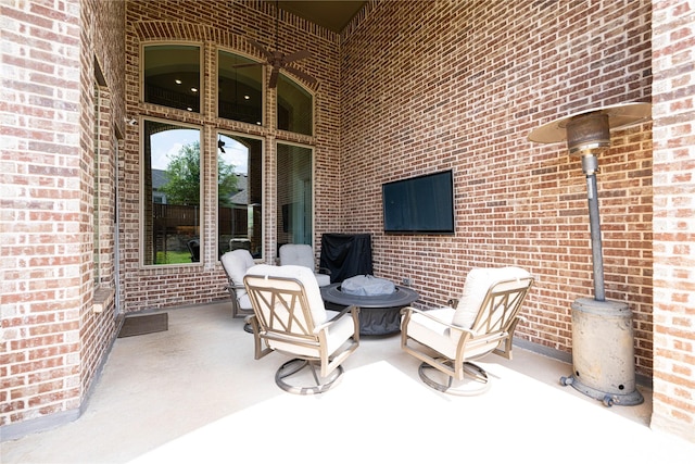 view of patio / terrace with an outdoor fire pit