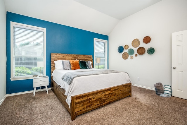 bedroom with carpet flooring, multiple windows, baseboards, and lofted ceiling