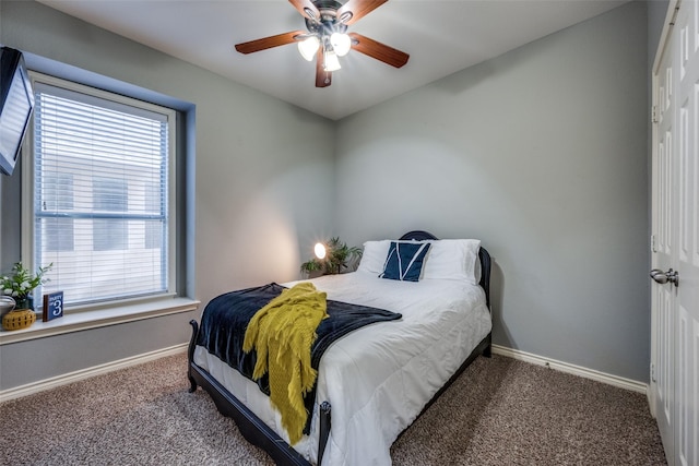 bedroom featuring a closet, carpet flooring, ceiling fan, and baseboards