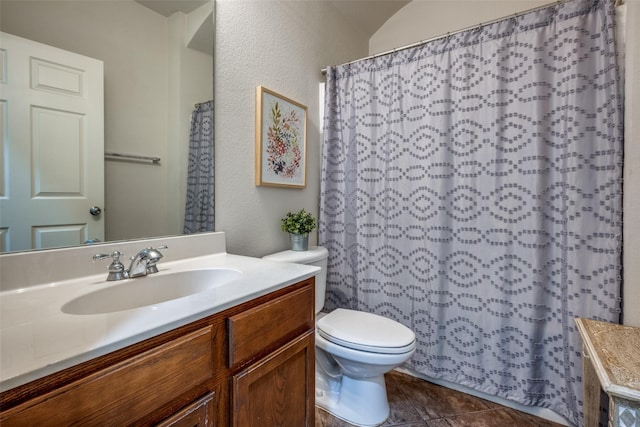 bathroom with vanity, tile patterned floors, toilet, and a shower with curtain