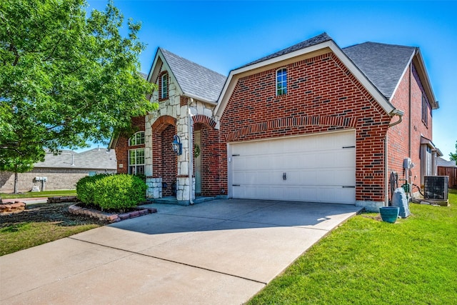 view of front of home with a front lawn, concrete driveway, a shingled roof, brick siding, and central AC unit