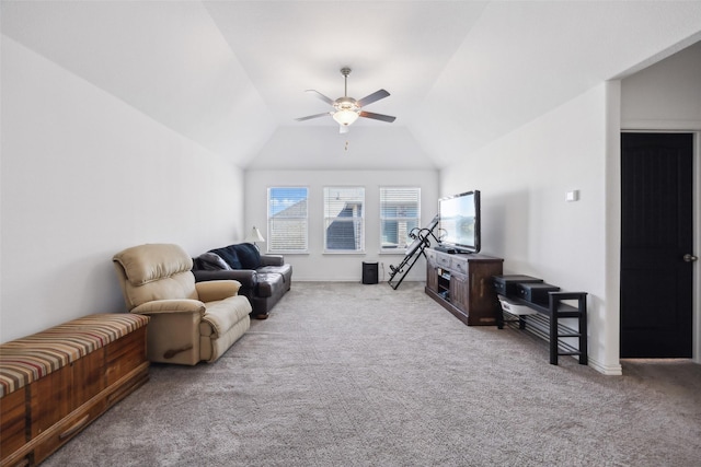 living area with lofted ceiling, carpet, baseboards, and ceiling fan