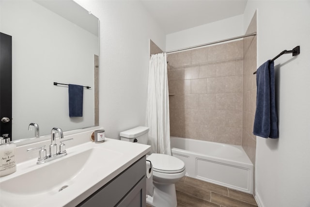 bathroom with toilet, vanity, wood finish floors, and shower / bathtub combination with curtain