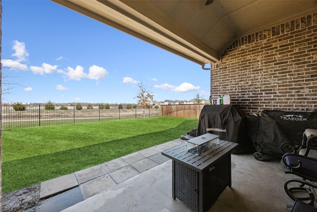 view of patio with a fenced backyard and grilling area