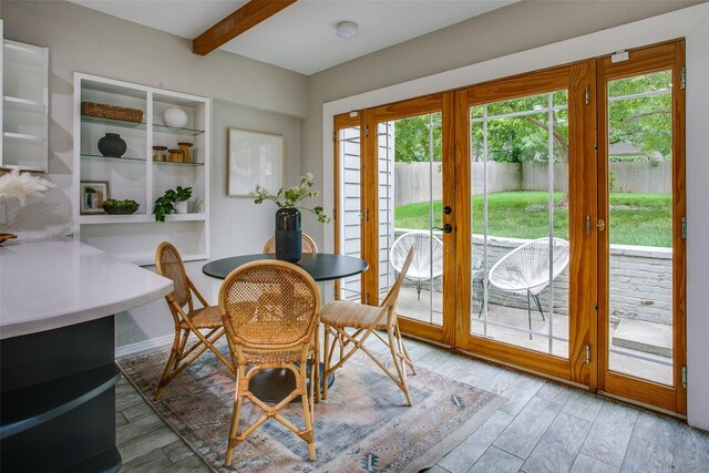 1311 Cedar Hill Ave, Dallas, TX 75208 - dining area featuring beam ceiling, french doors, and light wood-style flooring