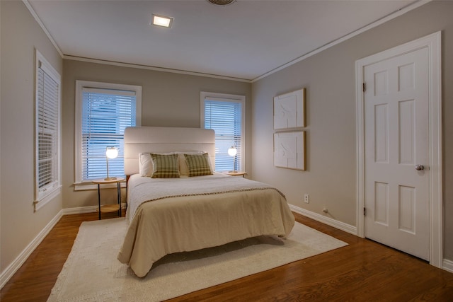 1311 Cedar Hill Ave, Dallas, TX 75208 - bedroom featuring crown molding, baseboards, dark wood-type flooring, and multiple windows