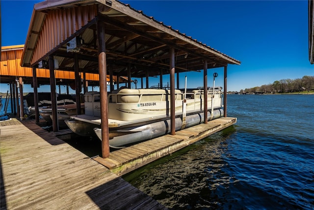 dock area featuring a water view and boat lift