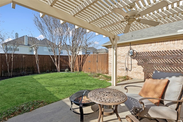 view of patio with a ceiling fan, a fenced backyard, a pergola, and a fire pit