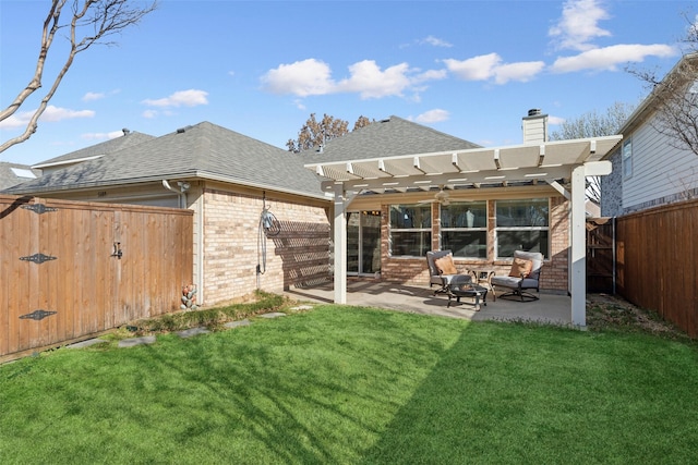 back of house featuring brick siding, a fenced backyard, a yard, a pergola, and a patio