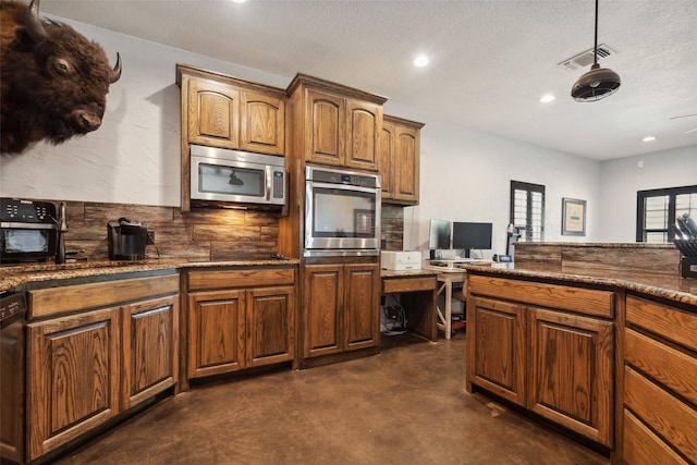 kitchen with visible vents, backsplash, concrete floors, appliances with stainless steel finishes, and a textured ceiling