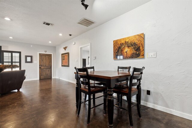 dining space with recessed lighting, visible vents, baseboards, and finished concrete flooring