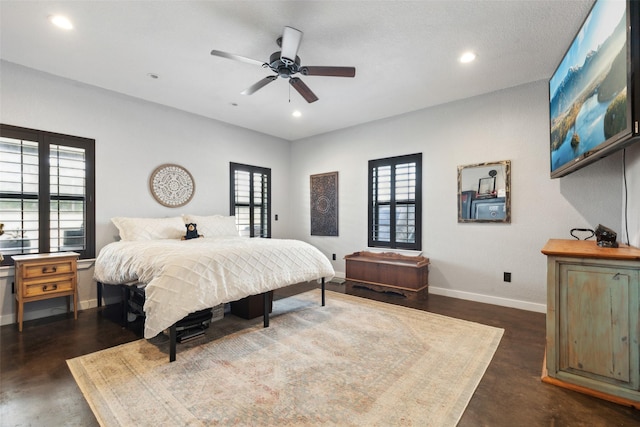 bedroom featuring multiple windows, recessed lighting, and baseboards