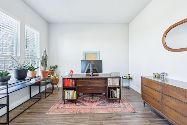 home office featuring baseboards and wood tiled floor