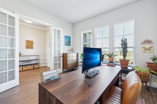 office space featuring french doors, baseboards, and wood finished floors