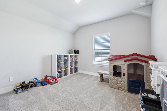 recreation room with lofted ceiling, carpet, and baseboards