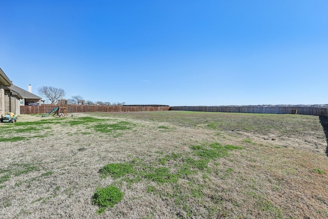 view of yard with fence