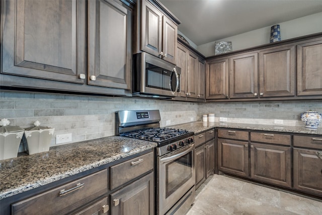 kitchen with stone counters, backsplash, and appliances with stainless steel finishes