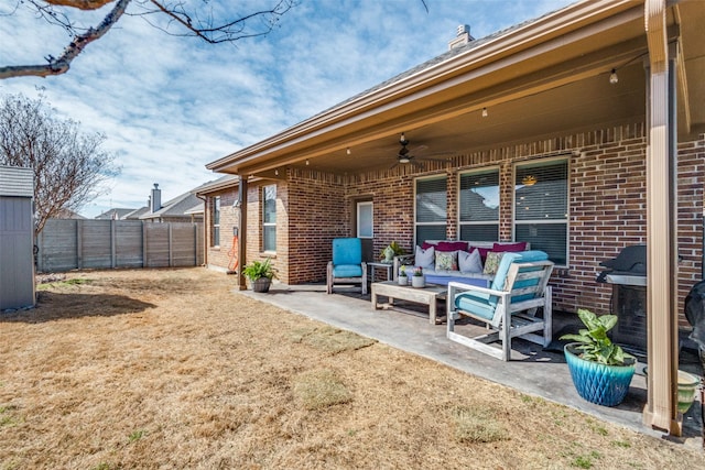 view of yard with a patio, an outdoor hangout area, fence, and ceiling fan