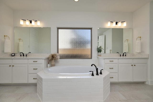 bathroom with a sink, two vanities, and a bath