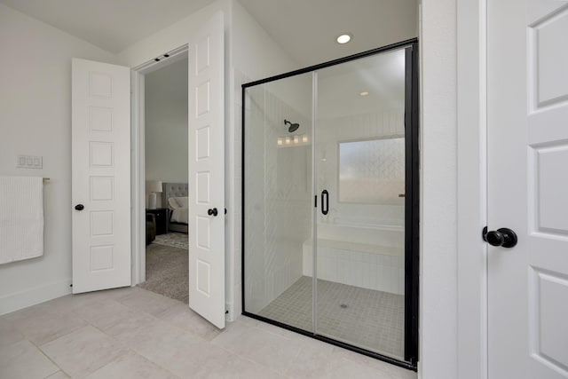 full bathroom with tile patterned floors, recessed lighting, a shower stall, and ensuite bathroom