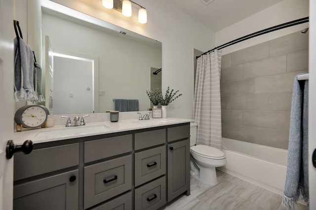 full bathroom with double vanity, shower / bath combination with curtain, toilet, and a sink