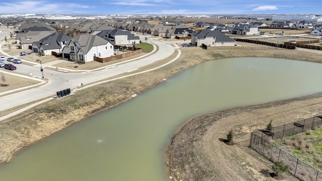 birds eye view of property featuring a residential view and a water view