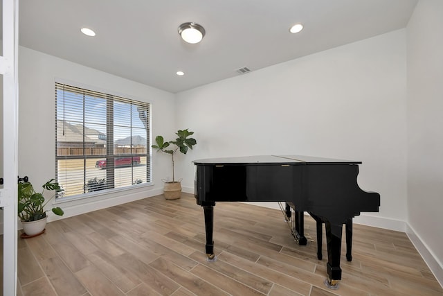 sitting room with recessed lighting, visible vents, baseboards, and light wood-style floors