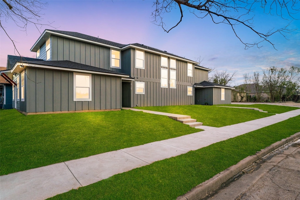 1801 S 19th St, Waco, TX 76706 - view of front of home with a yard, roof with shingles, and board and batten siding