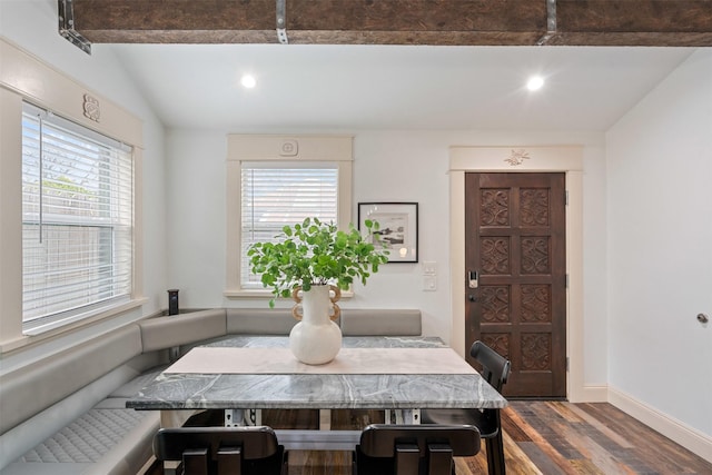 dining room with recessed lighting, lofted ceiling, dark wood-type flooring, and baseboards