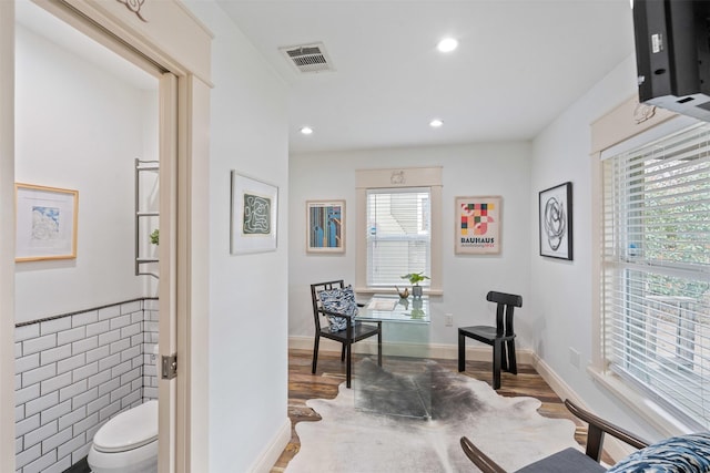 interior space with visible vents, toilet, wood finished floors, recessed lighting, and baseboards