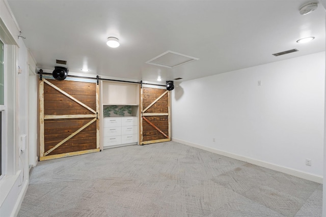 carpeted empty room featuring visible vents and baseboards